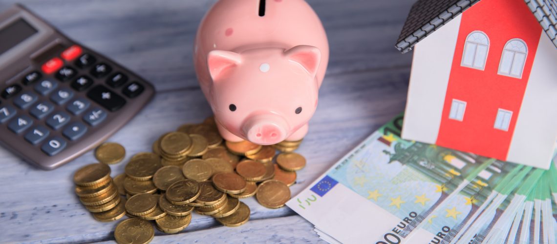 Saving money for real estate concept on table