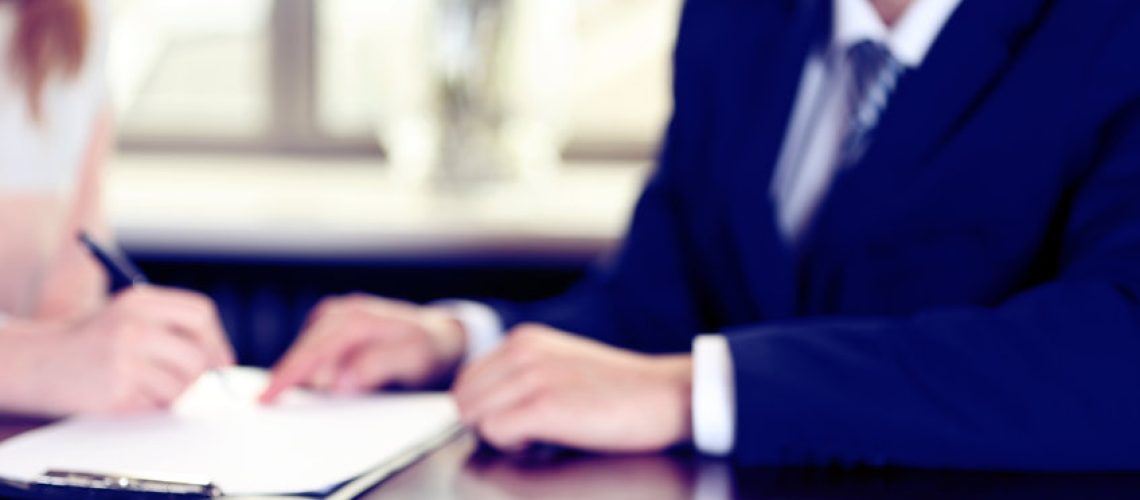 Signing of contract and keys on table, close-up