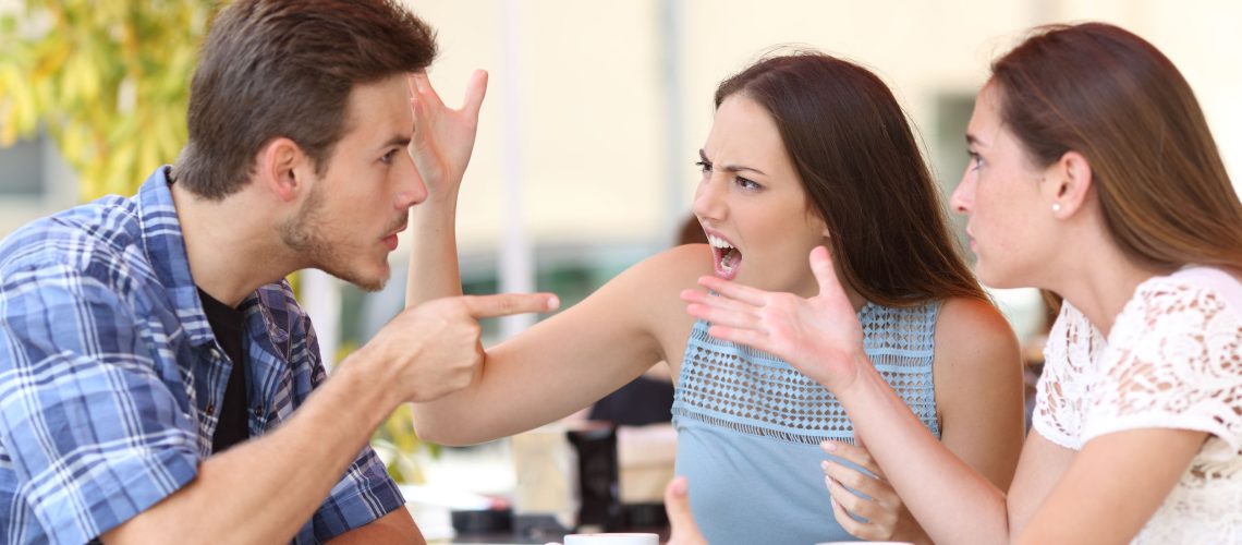 Angry friends arguing in a coffee shop