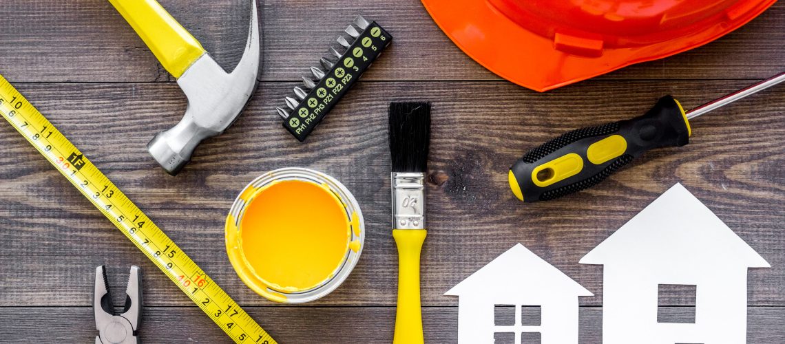 Reparing home concept. Tools on wooden desk background top view.